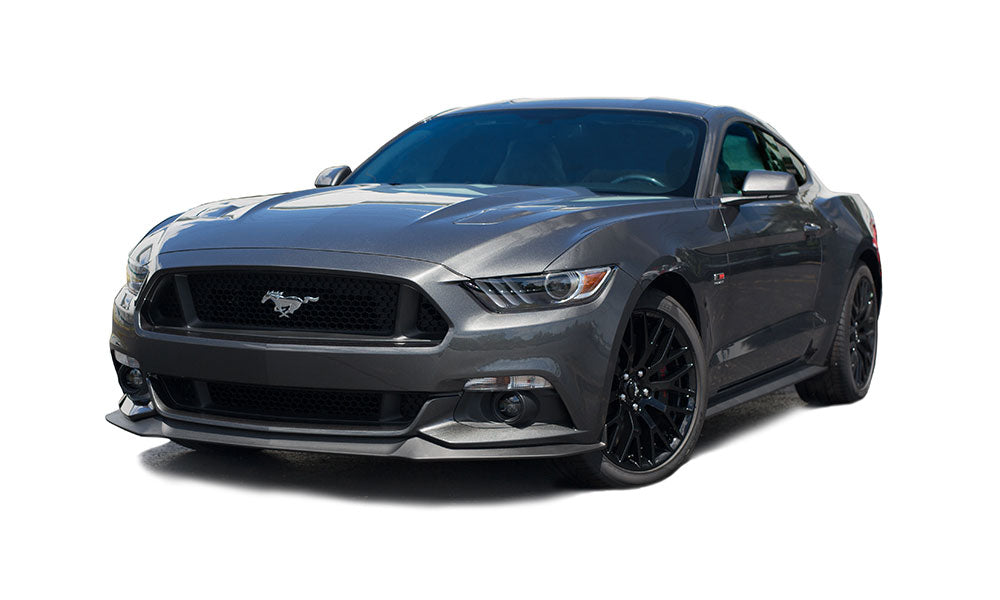A sleek, gray ROUSHcharged Mustang sports car showcasing a prominent grille and black alloy wheels, viewed from the front and side. This 670-horsepower beast is part of the ROUSH Stage 3 line, combining power with exquisite design.