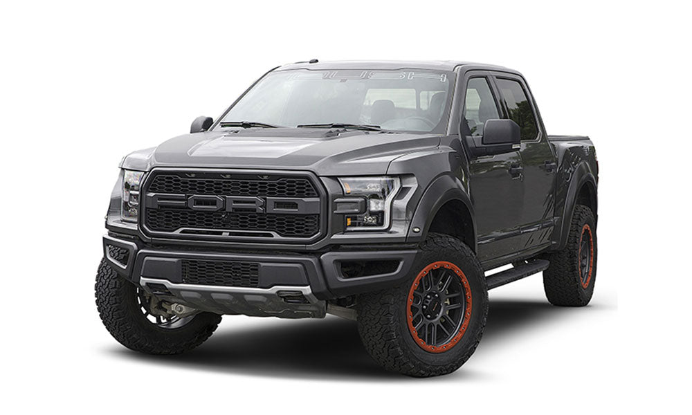 Gray pickup truck with off-road tires and bead protection wheels, featuring a distinctive front grille, shown on a white background.