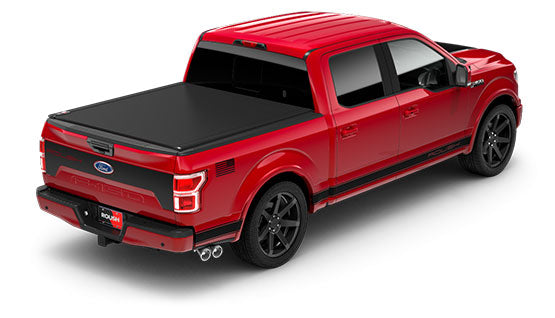 A red ROUSH F-150 Sport pickup truck with a covered bed and black wheels, viewed from the rear three-quarters, showcases its sleek design enhanced by the active exhaust system.