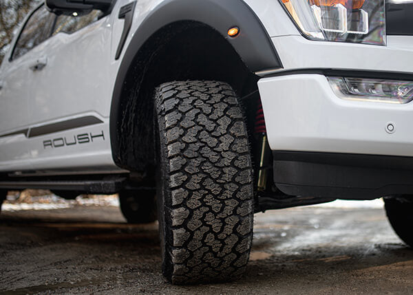 Ford truck with wheel turned toward viewer