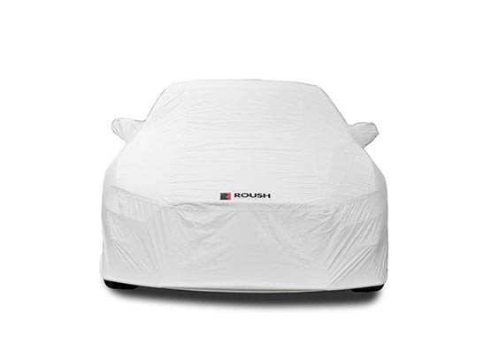 A sleek Roush Mustang car cover drapes over the vehicle, showcasing the iconic logo. Crafted from water-resistant fabric, this Stormproof Car Cover ensures your car stays protected in style.