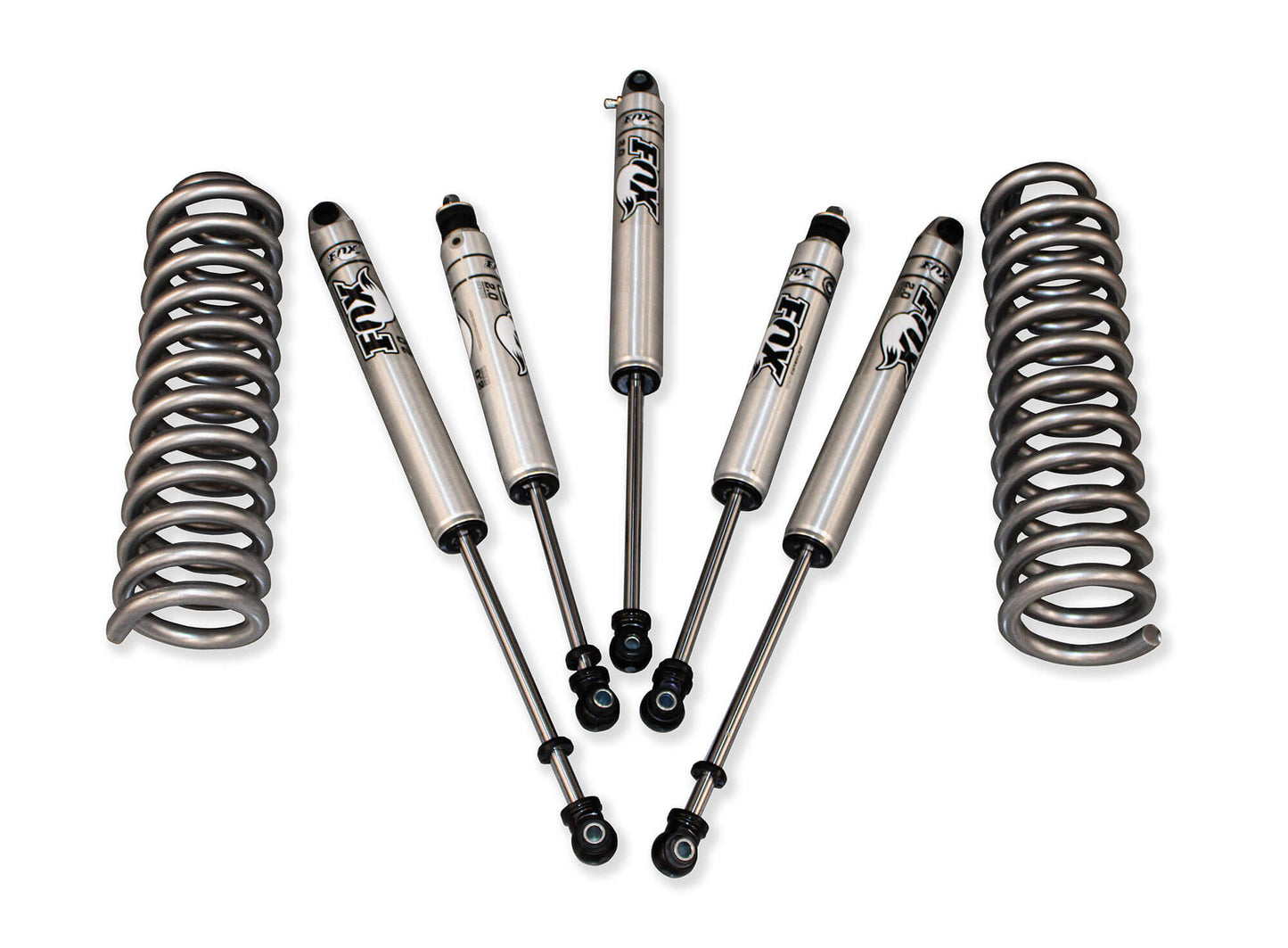 A set of car suspension parts arranged on a white background, including two coiled springs and four Fox shocks marked "FORD Super Duty.