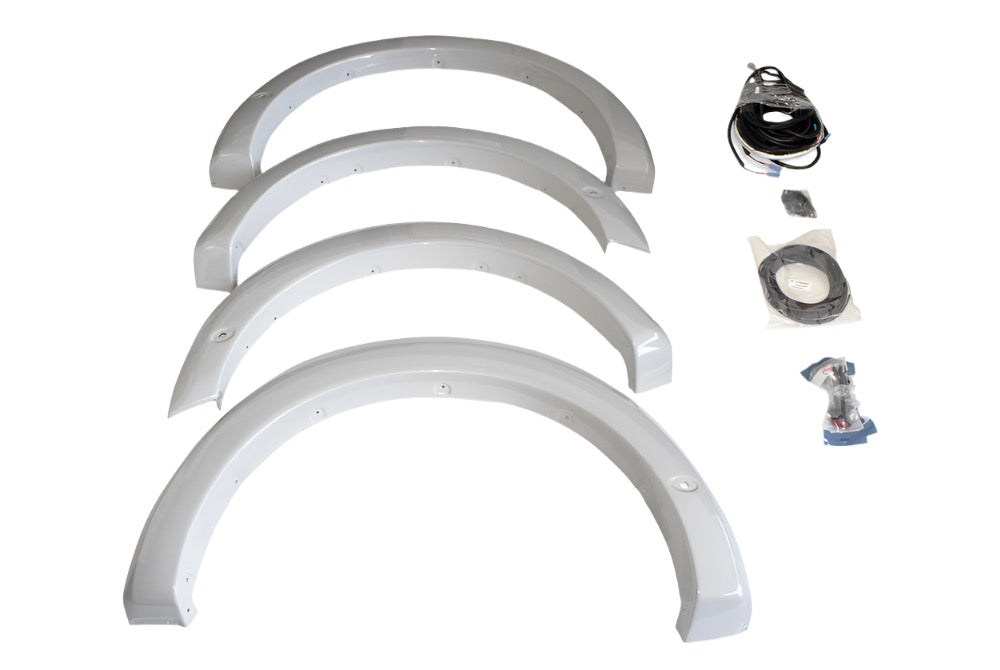 Four primed fender flares are arranged in a row, accompanied by cables and accessories on the right side. Perfect for those seeking a sleek upgrade, this F-150 fender flare kit brings both style and functionality to your vehicle.