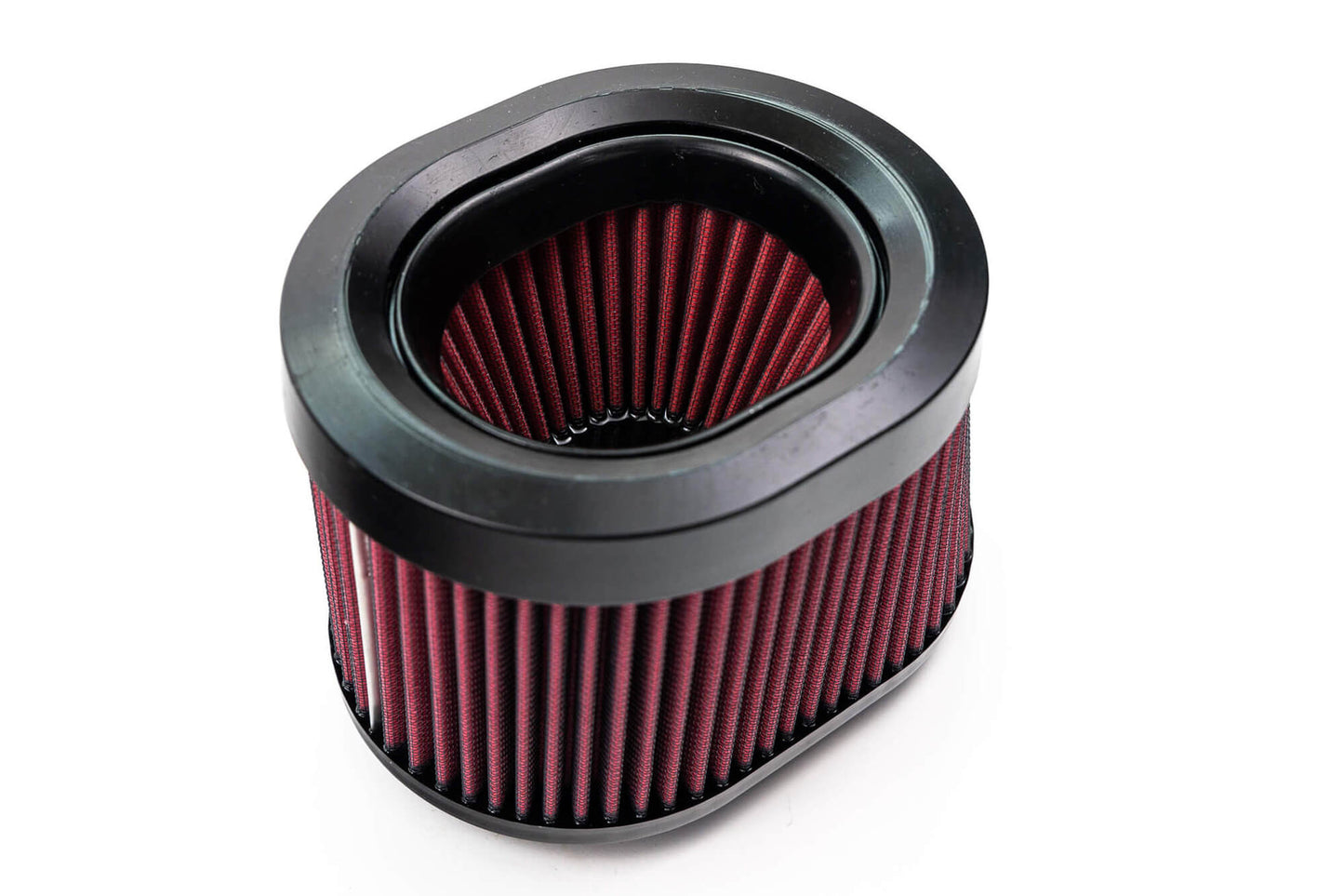 A close-up of a cylindrical air filter with a black frame and red pleated filter material, designed for the Roush Bronco Air Induction System, perfect for enhancing your Ford Bronco's off-road racing experience.