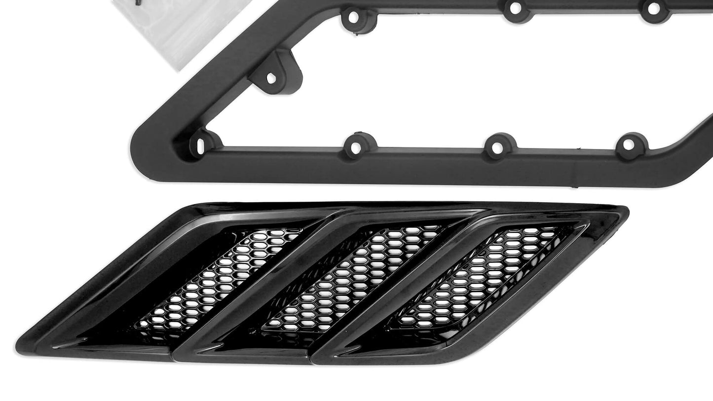 Close-up of a black plastic car grille component with three vent slots and a mesh design, next to frame-like high-performance design parts with circular attachment points, reminiscent of the Roush Mustang's fender vent heat extractors.