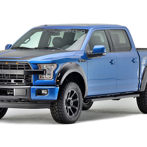 A blue ROUSH F-150 pickup truck with black detailing, four doors, and rugged tires boasting off-road performance is displayed on a white background.
