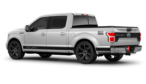 
                  
                    A silver Ford pickup truck with ROUSH F-150 Sport branding, featuring black wheels and black trim, is viewed from the rear side. Enhanced by a ROUSH Performance Exhaust System, this vehicle exudes both style and power.
                  
                
