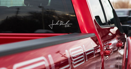 
                  
                    Red truck with "Jack Roush USA" signature on the window and "ROUSH" lettering emblazoned on the side of the bed. This ROUSH Super Duty combines iconic design with impressive towing capabilities, making it a powerhouse of performance.
                  
                