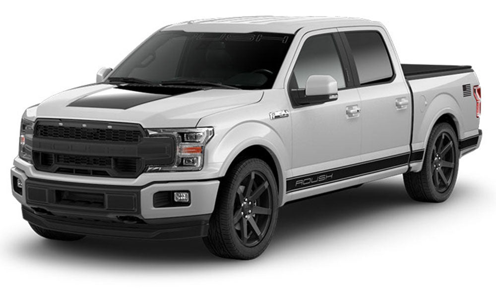 The ROUSH F-150 Sport is a striking white pickup truck with black accents on the hood and sides, complemented by dark wheels and tinted windows. Its ROUSH Performance Exhaust System ensures an exhilarating drive.