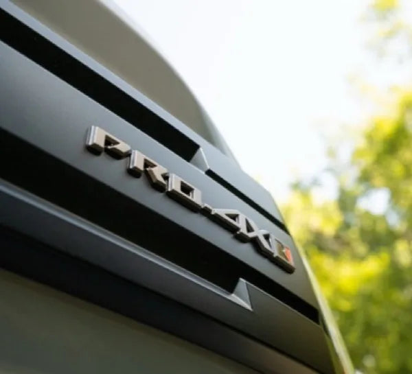 "R" badging on the grille, fenders, and tailgate, signaling its Roush pedigree