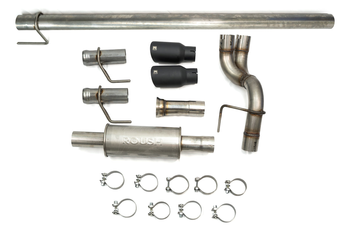 
                  
                    A car exhaust system kit laid out, featuring pipes, a muffler, two black tip exhausts, clamps, and connectors—all displayed on a white background.
                  
                