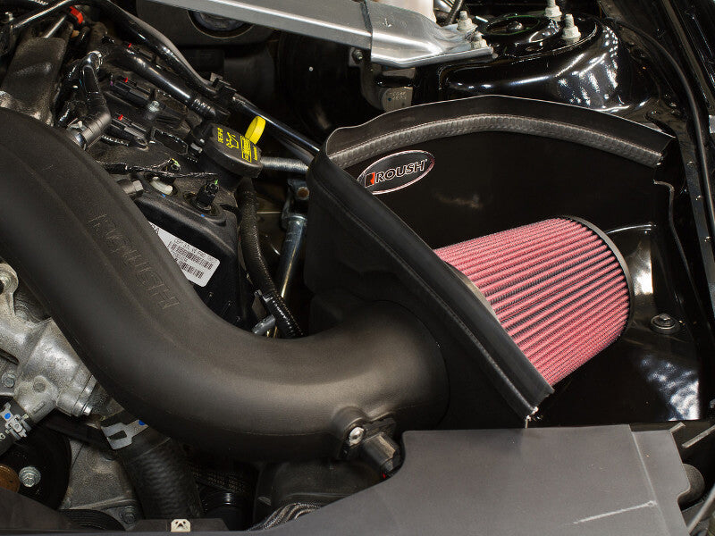 
                  
                    A close-up of a 2011-2014 Roush Mustang Cold Air Intake Kit 3.7L V6 engine compartment highlighting a red air filter inside a black casing with various engine components visible from Roush Performance Products, Inc.
                  
                