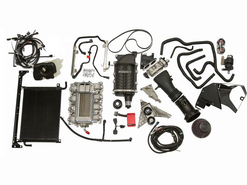 A collection of automotive engine parts, featuring hoses, filters, and a radiator, all arranged on a white background. Highlighted is the Roush Mustang Supercharger with Eaton's TVS Technology for enhanced performance.
