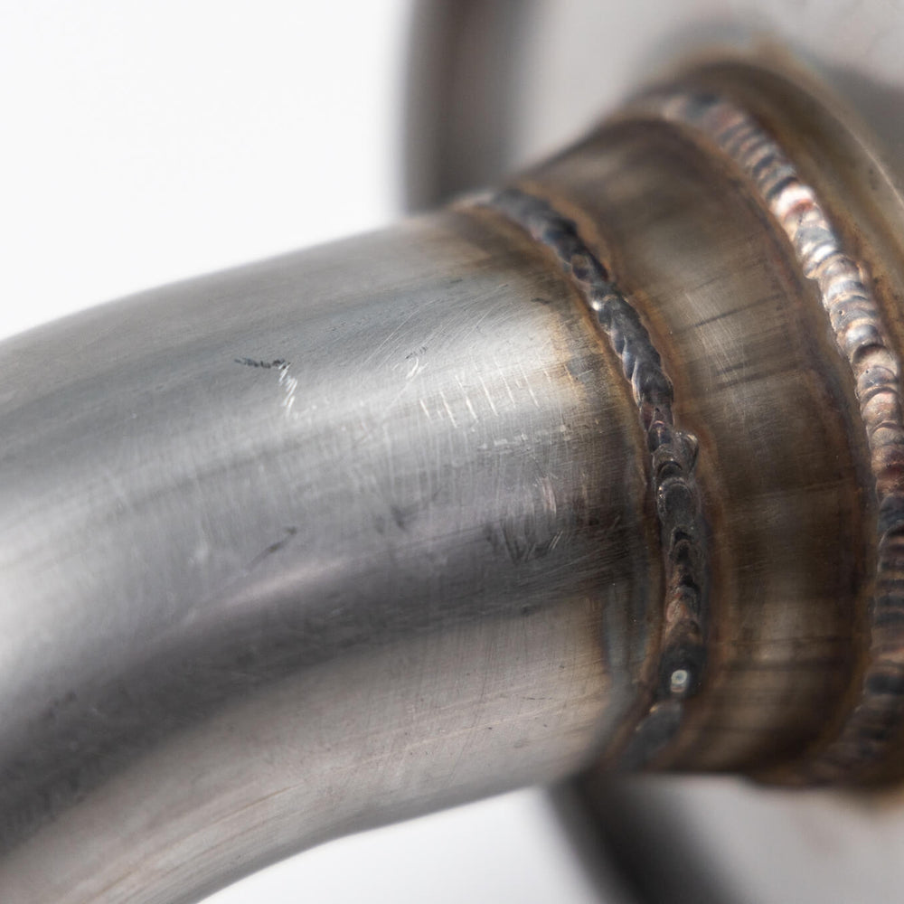 
                  
                    Close-up image of a welded joint on a metal pipe, showcasing detailed weld beads and the aggressive sound of the Roush Bronco Performance Exhaust 2.3 and 2.7 from Roush Performance Products, Inc.
                  
                