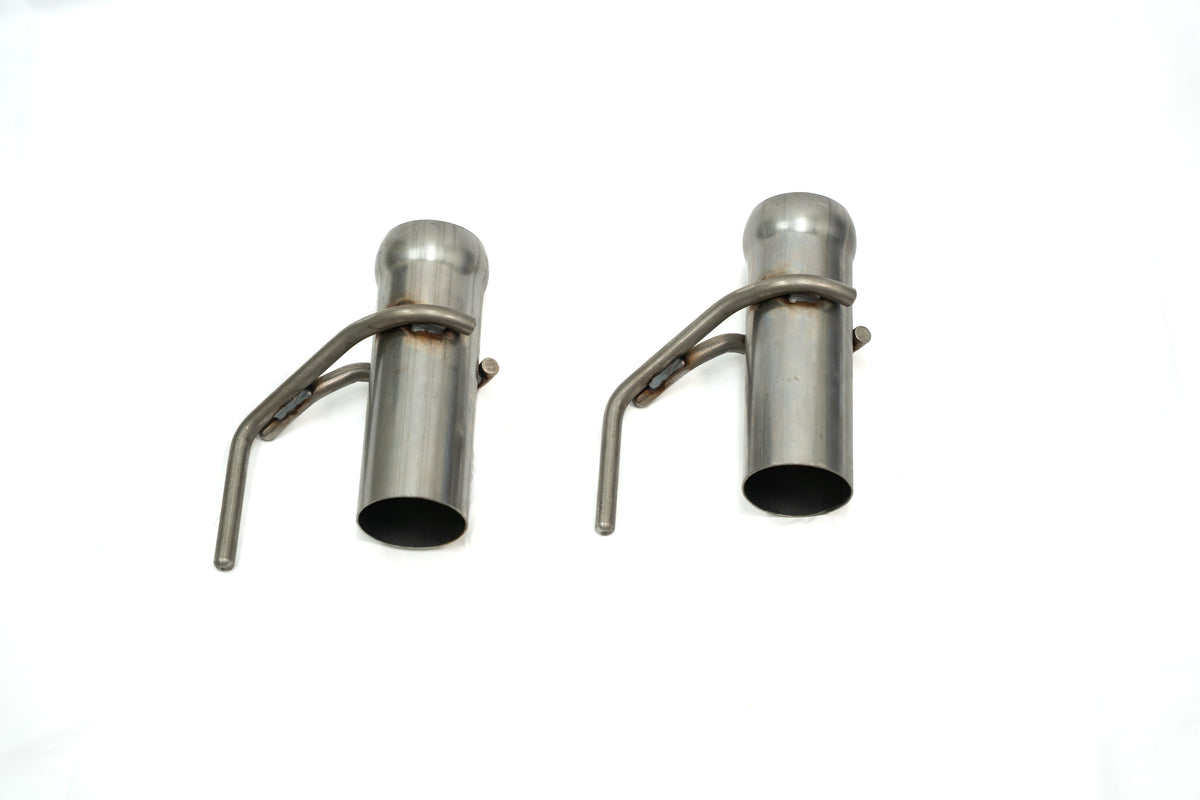 
                  
                    Two identical metal pipe nozzles with attached levers, reminiscent of components from a Roush F-150 cat-back exhaust, are positioned side by side on a white background.
                  
                