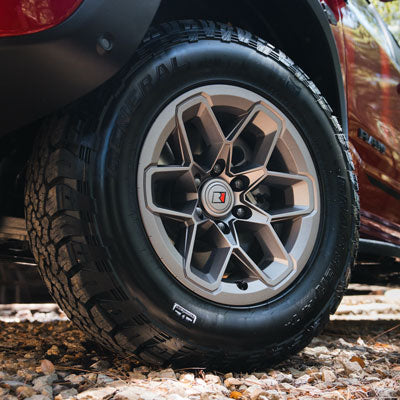 18-inch Roush-designed off-road wheels wrapped in 33-inch General Tire Grabber A/TX all-terrain tires.