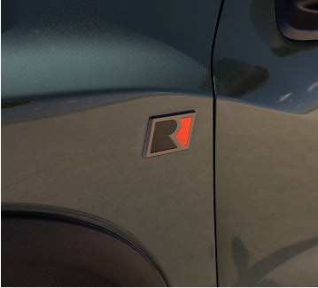 "R" badging on the grille, fenders, and tailgate, signaling its Roush pedigree
